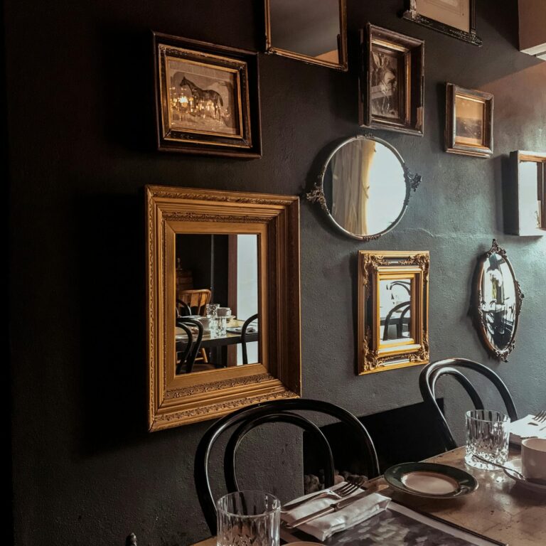 Cozy dining room with vintage mirrors and elegant table setting.