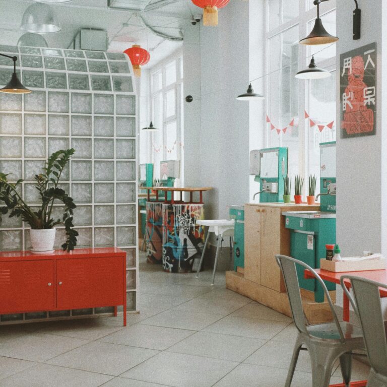 Spacious modern café interior in Kyiv with colorful decor and natural light.
