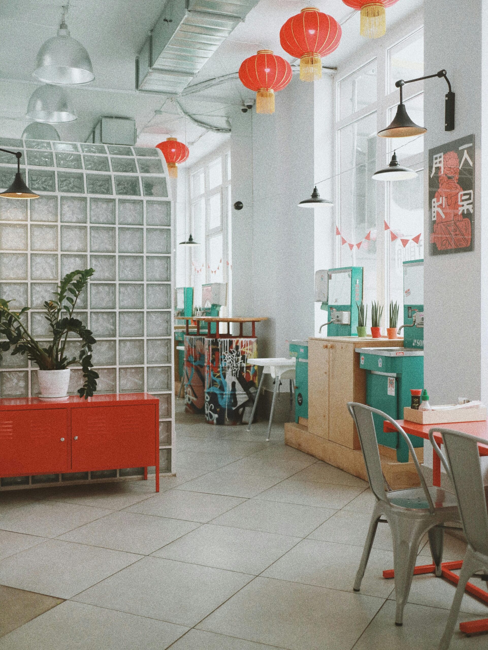 Spacious modern café interior in Kyiv with colorful decor and natural light.